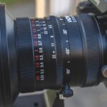 Close-up of a Laowa lens attached to a camera