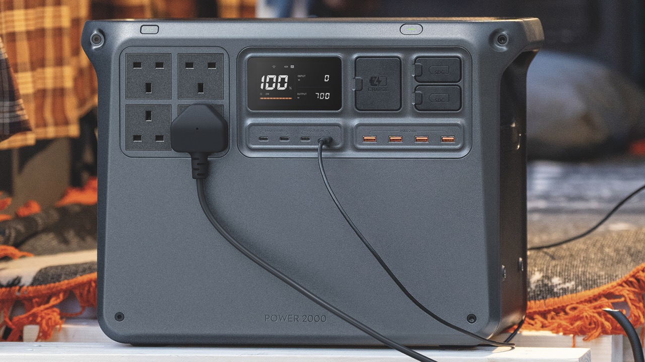 A power source from DJI with wires extending from the back