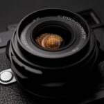 A close up of a lens from Thypoch, against a black background