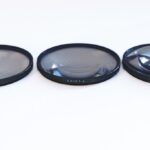 Three Polarpro screw-in dioptre filters, against a white background