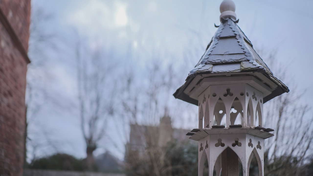 A small gazebo against a blurred, dusk sky