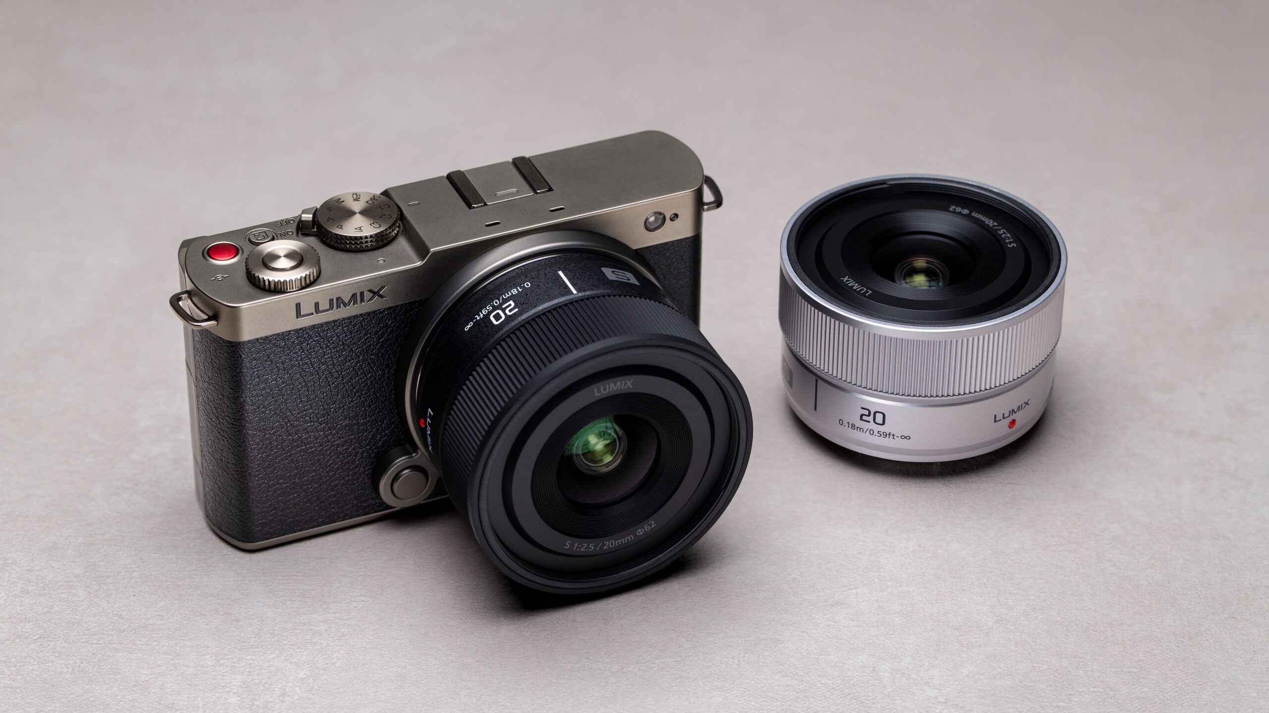Panasonic LUMIX S-S20 lens attached to camera in black and silver