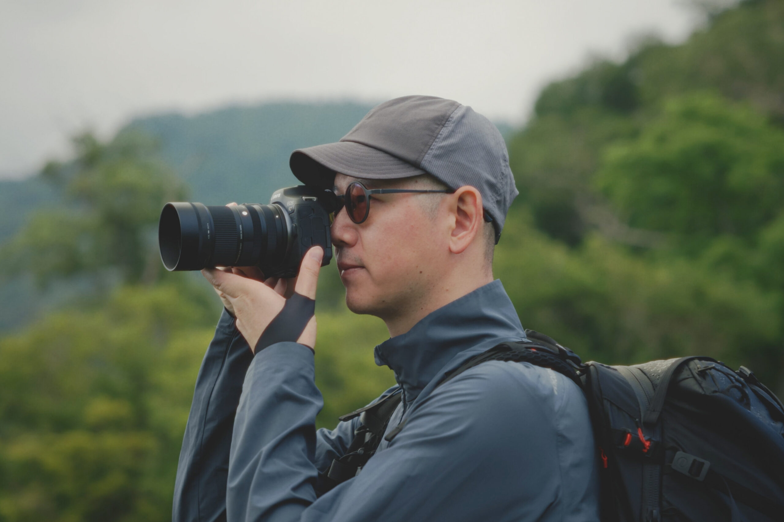 man using Sigma new 50-120mm F2.8 DC OS Contemporary lens on camera